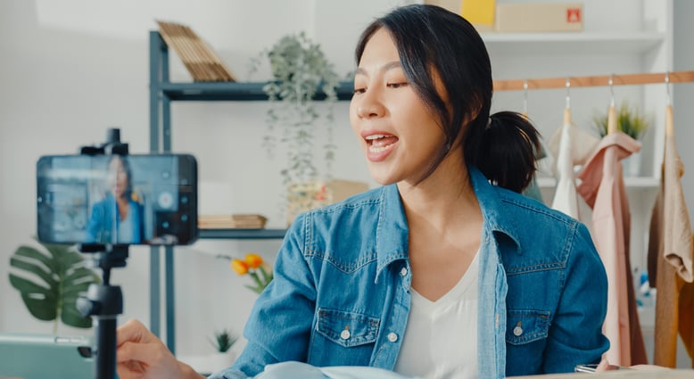 young-asia-lady-fashion-designer-using-mobile-phon-2021-09-02-09-22-29-utc